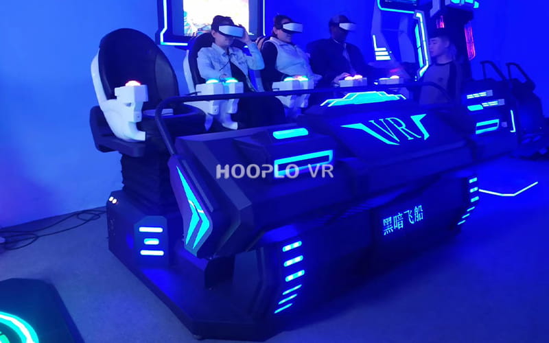 Customers experiencing immersive content on VR Four Seat Cinema A in a commercial entertainment venue.