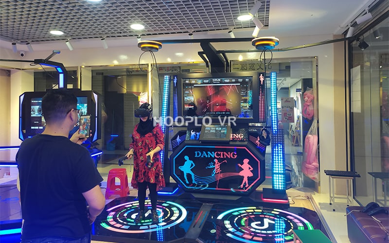 Customer actively playing VR Dance Machine VR equipment, demonstrating fun gameplay.