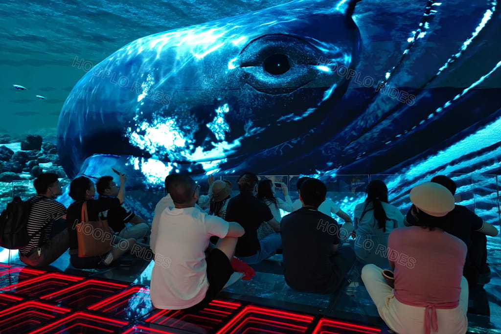 Visitors enjoying underwater whale scene inside Hooplo Suspended Glass Immersive 3D Space, viral check-in naked eye 3D glass tunnel with surround LED screen