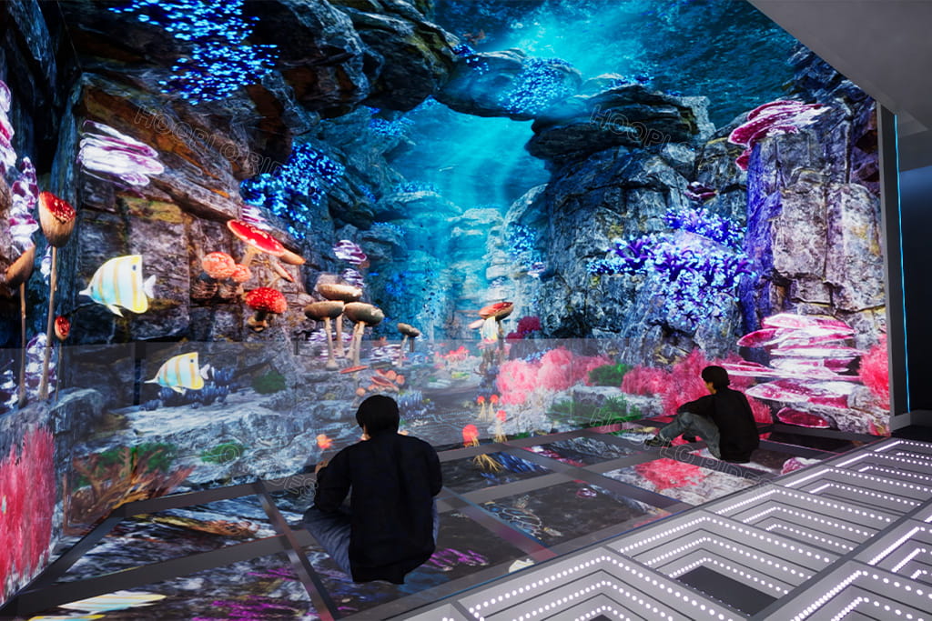 Suspended Glass Theater operating in the Hooplo VR factory showroom, demonstrating an immersive interactive experience with floor-to-ceiling projection effects.